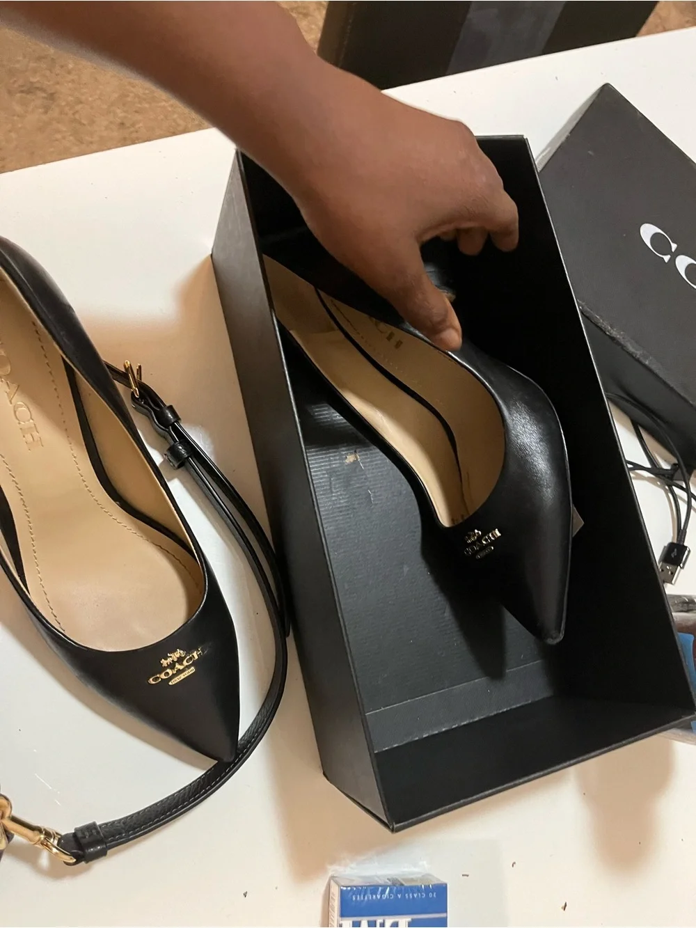 Coach Black Leather Pointed-Toe Pump with Gold Logo Accent. The purse is nwot